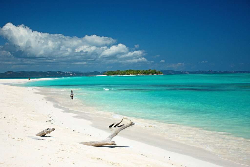 Travelgoals 2024 - Sandy beach with clear blue water from a paradise