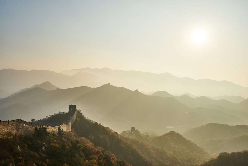 a wall on a mountain. The real wall. The Great Wall. 10 miles in China. A very special place from our world to travel. 