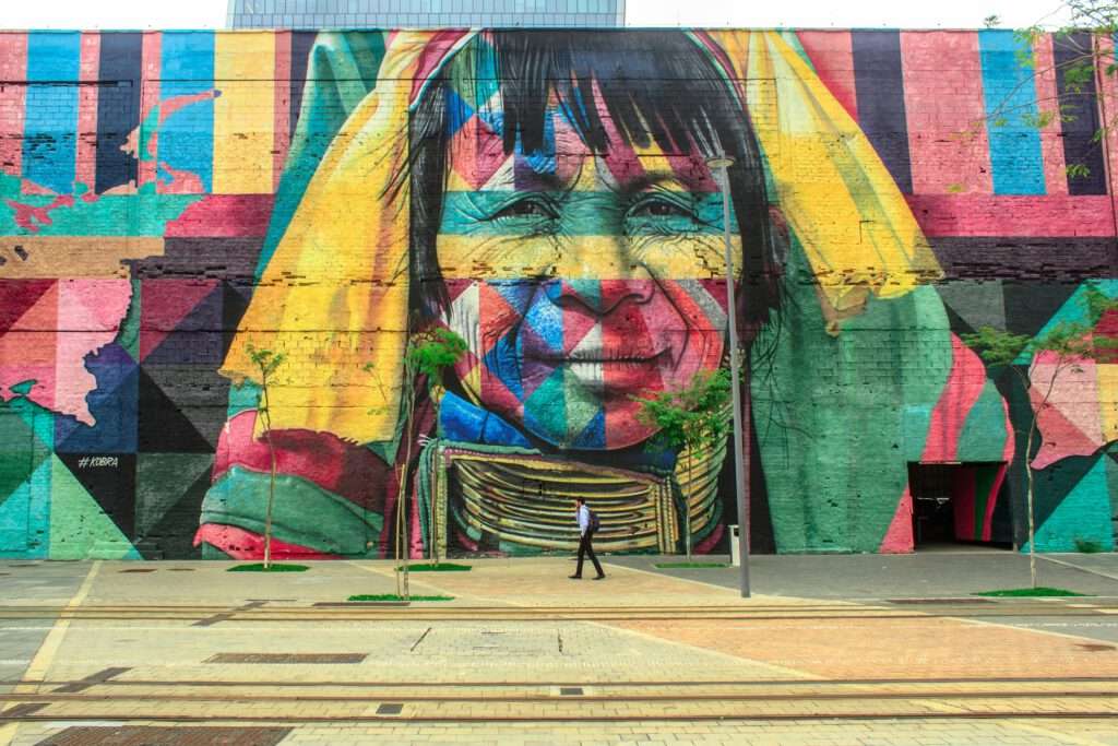 Top 10 Tips work and travel - 3D drawing on facade of an Indian face with flags painted over it. 