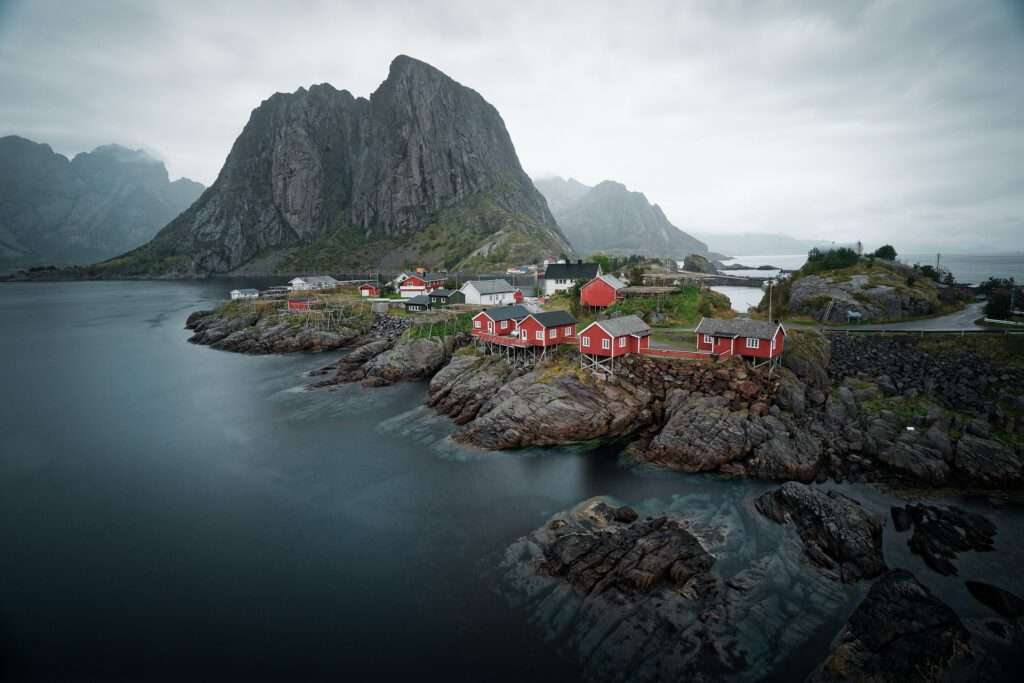 Travelgoals 2024 - red houses in a rocky environment, with some water